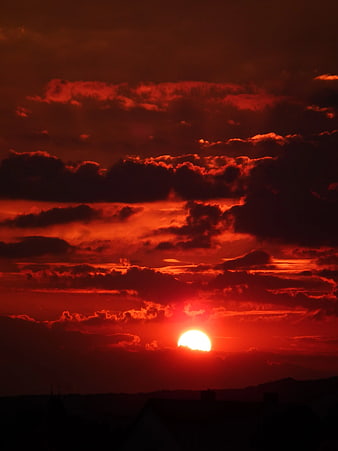 Dramatic Red Sunset Sky with Dark Clouds