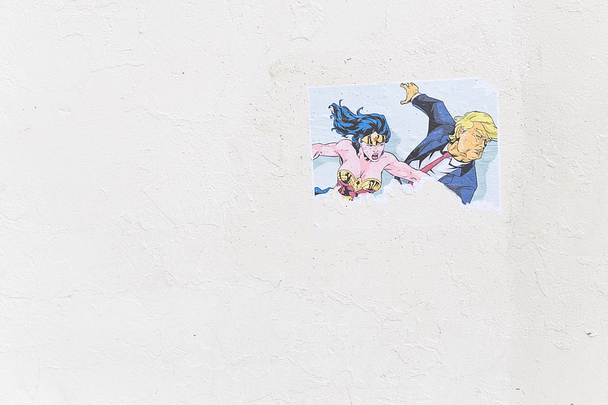 Wonder Woman and Trump Sticker on White Wall
