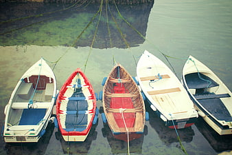 Aerial View of Five Small Fishing Boats Moored in Calm Water