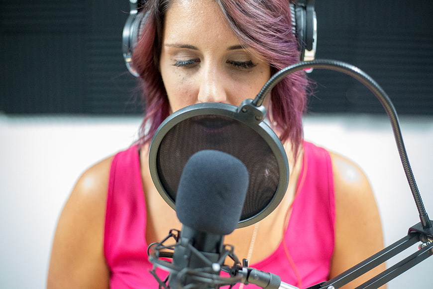 Woman with Pink Hair Recording in Studio
