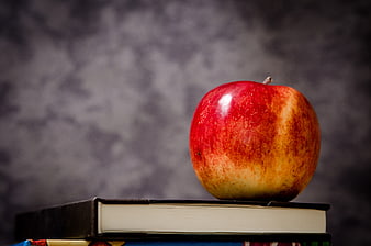 Red Apple on Stack of Books for Education Concept