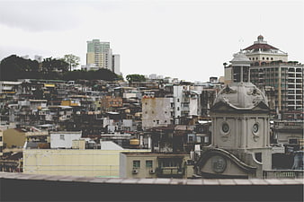Urban cityscape with historic church tower and dense housing