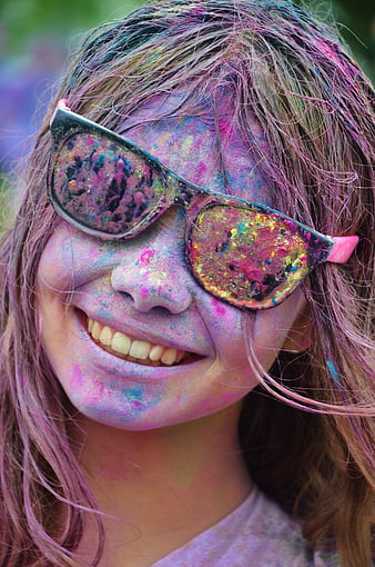 Happy Girl Covered in Colorful Powder at Holi Festival