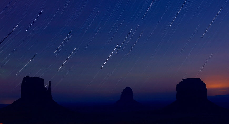 Star Trails Over Desert Buttes at Twilight