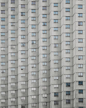 Abstract Concrete Apartment Building Facade with Repeating Windows