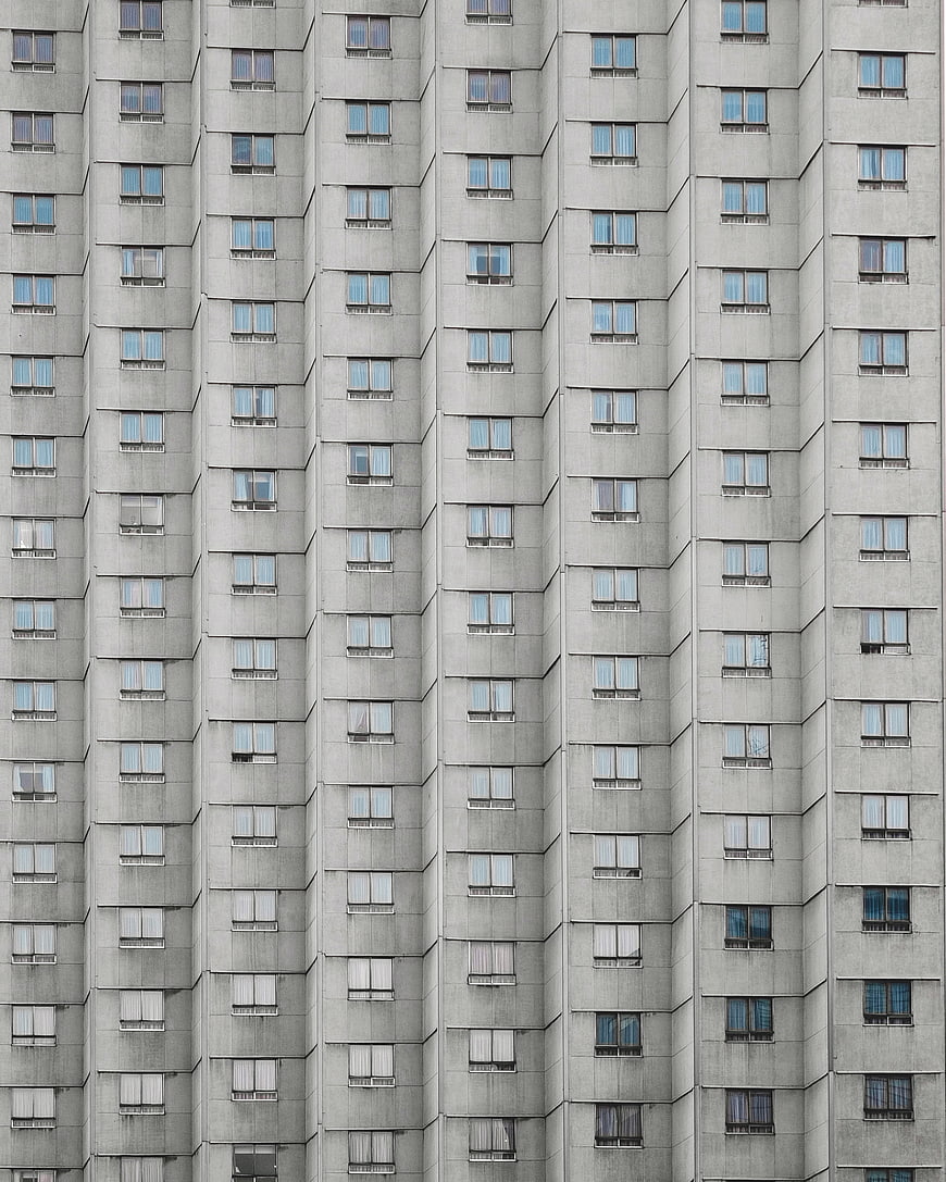 Abstract Concrete Apartment Building Facade with Repeating Windows