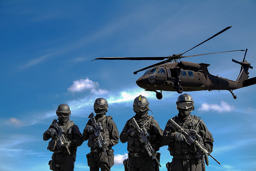 SWAT team soldiers with helicopter in blue sky