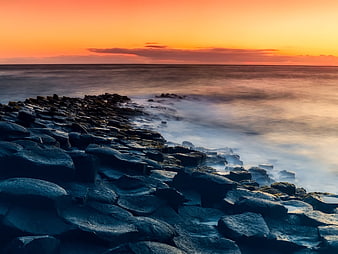 Long Exposure Sunset Over Rocky Coastline