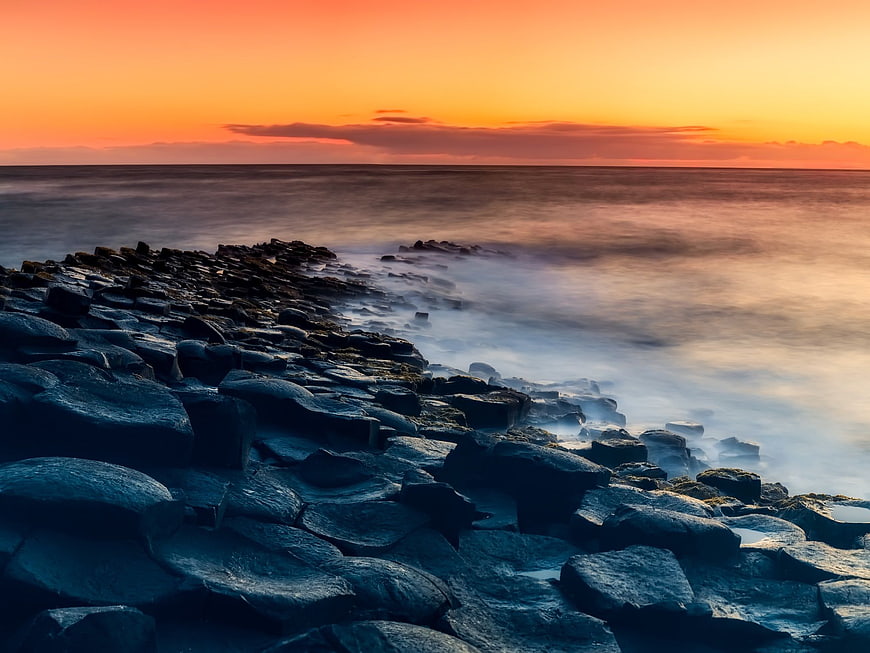 Long Exposure Sunset Over Rocky Coastline