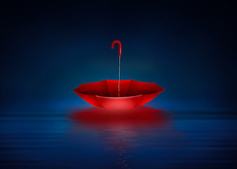 Red Umbrella Floating on Dark Blue Water at Night