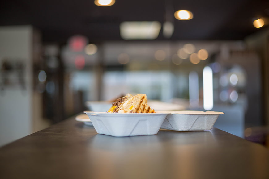 Takeout Sandwich in White Container on Restaurant Counter