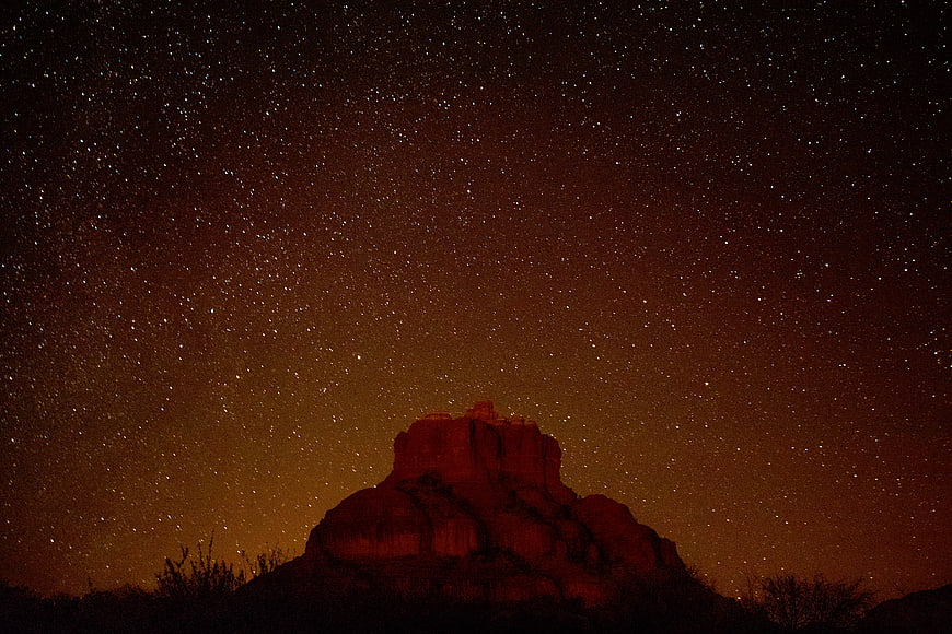 Starry Night Sky Over Red Rock Butte Landscape