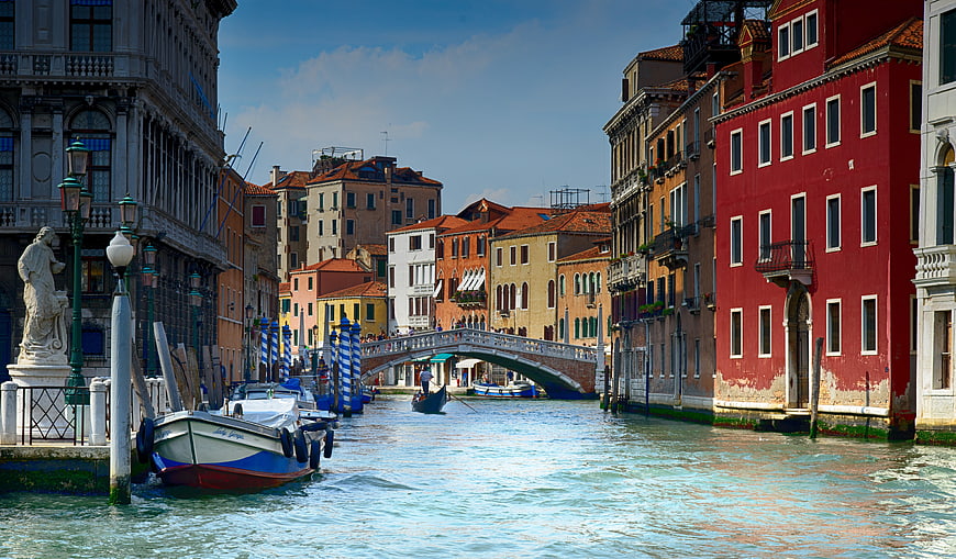 Venice Canal View With Historic Buildings And Bridge