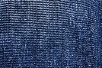 Close-up texture of blue denim fabric weave pattern