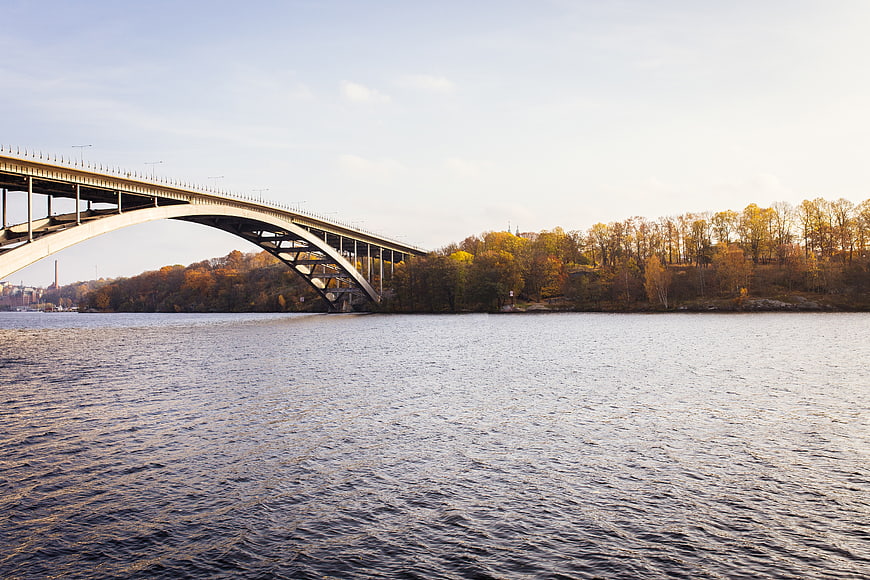 Autumn Landscape with Arch Bridge Over Water