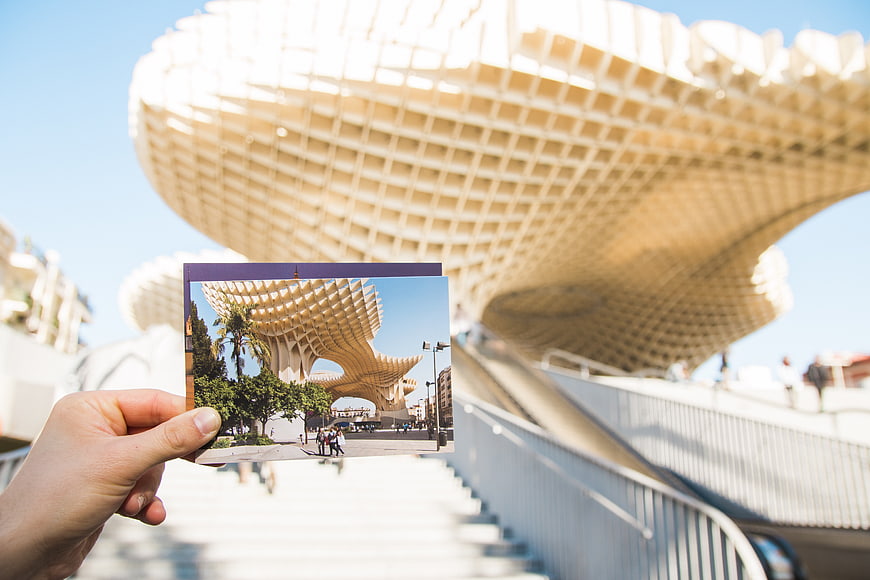 Hand holding photo of Metropol Parasol in Seville