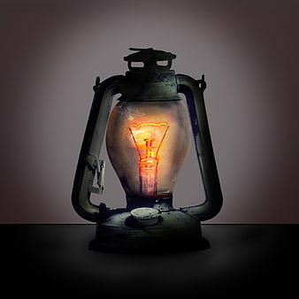 Vintage Oil Lantern With Glowing Filament Bulb On Dark Background