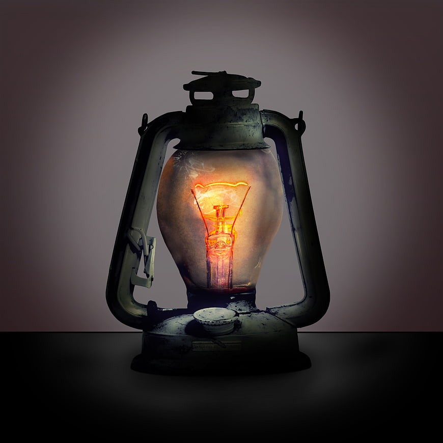 Vintage Oil Lantern With Glowing Filament Bulb On Dark Background