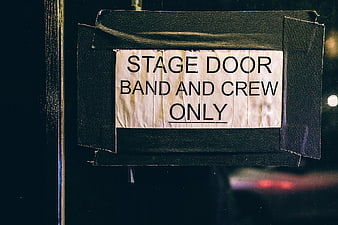 Stage Door Band and Crew Only Sign at Night