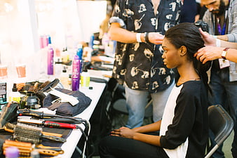 Backstage Hair Styling Session With Professional Tools And Products