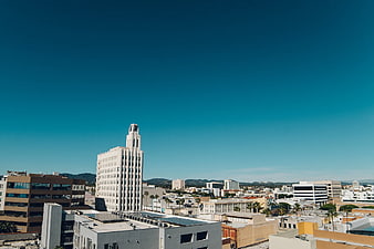 Cityscape with Art Deco Building Under Blue Sky