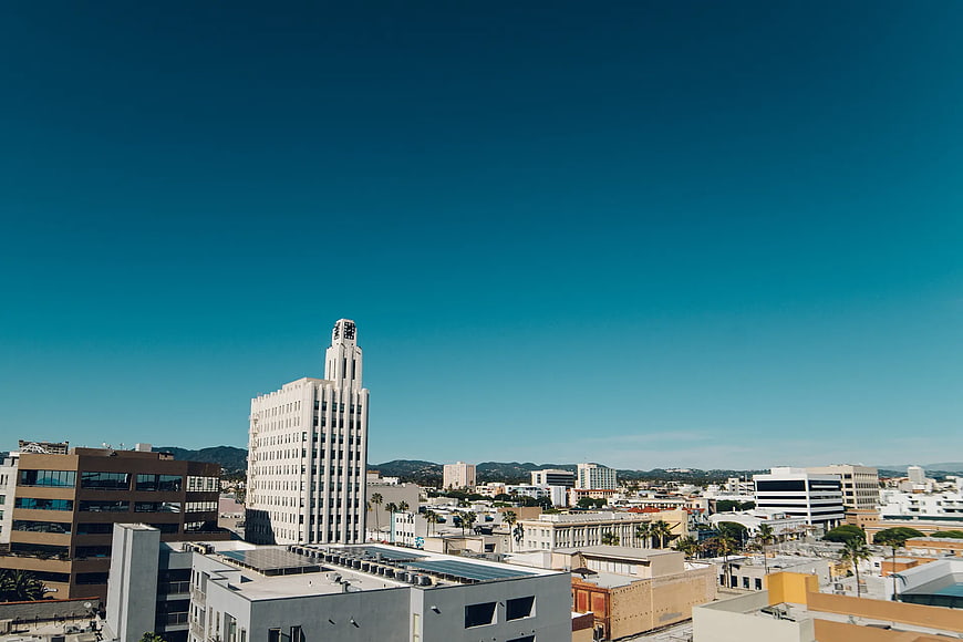 Cityscape with Art Deco Building Under Blue Sky