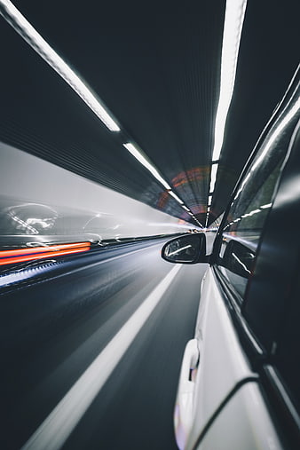 Fast Car Driving Through Tunnel at Night with Motion Blur