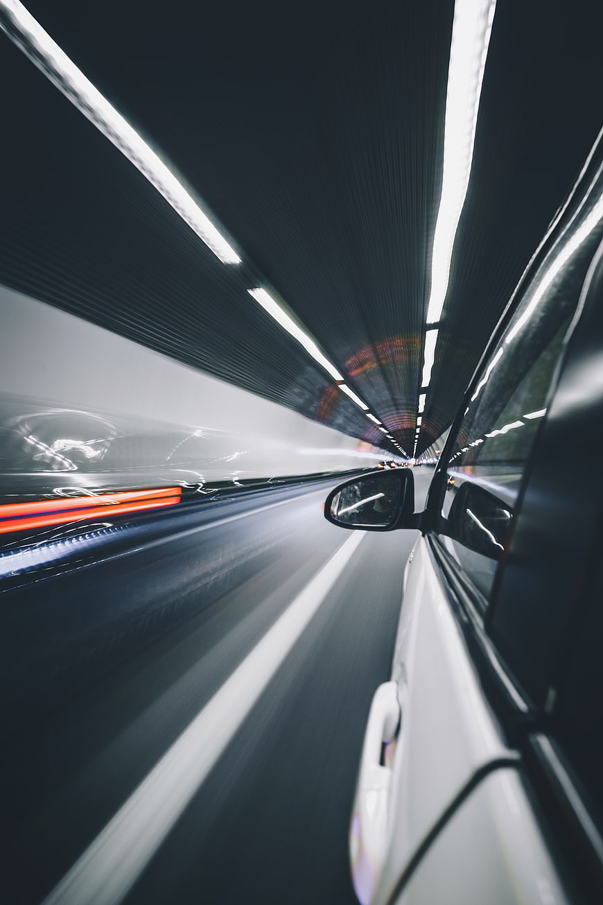 Fast Car Driving Through Tunnel at Night with Motion Blur