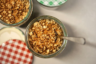 Overhead view of overnight oats in glass jars with checkered lids