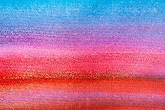 Abstract watercolor texture with blue, pink, and red gradient