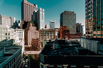 Urban cityscape with skyscrapers and teal sky