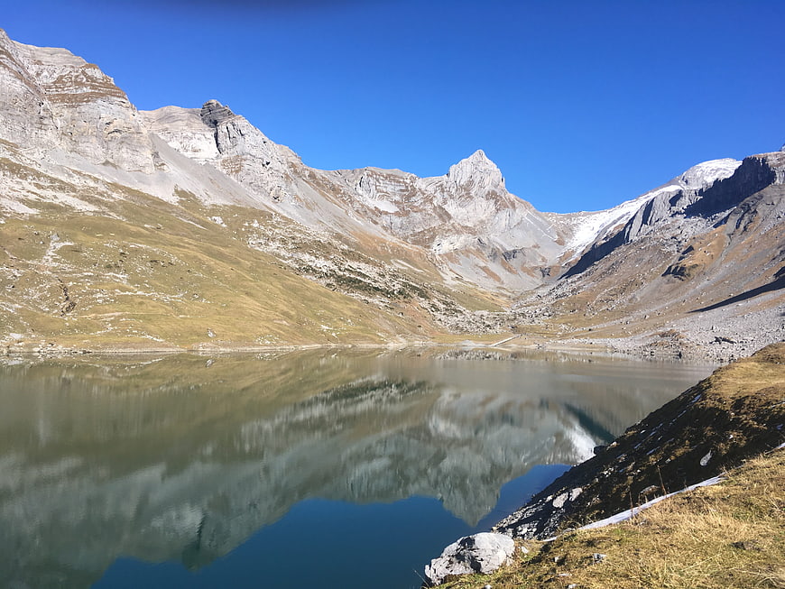 Serene Alpine Lake with Mountain Reflections