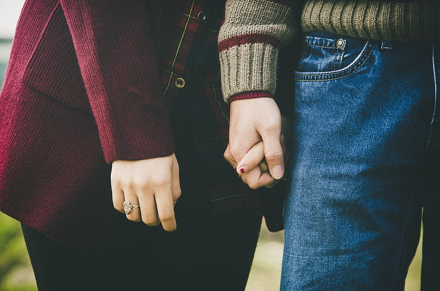 Couple Holding Hands in Casual Fall Fashion