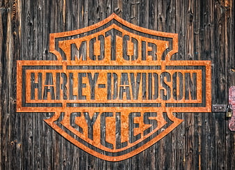 Rusty Harley-Davidson Metal Sign on Weathered Wood Barn Door