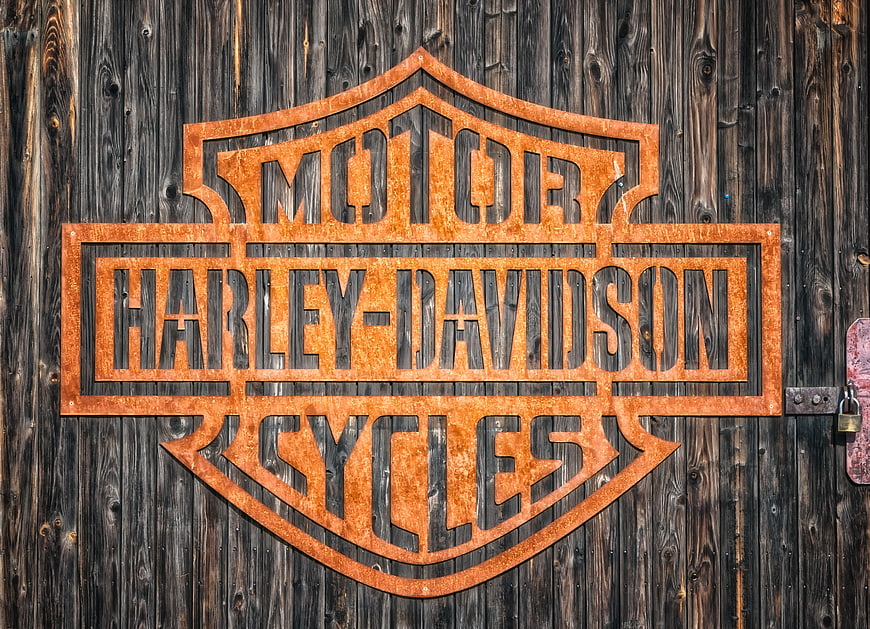 Rusty Harley-Davidson Metal Sign on Weathered Wood Barn Door