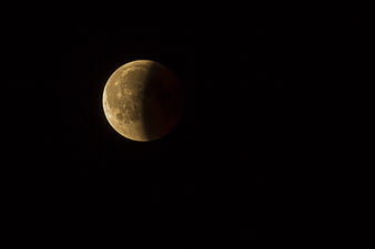 Gibbous Moon in Dark Night Sky