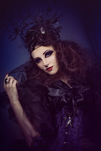 Gothic woman in dark fantasy costume with dramatic makeup