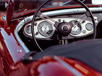 Vintage Red Car Interior with Classic Steering Wheel