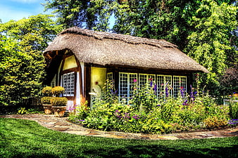 Rustic Thatched Cottage in Lush Garden