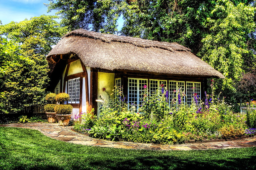 Rustic Thatched Cottage in Lush Garden
