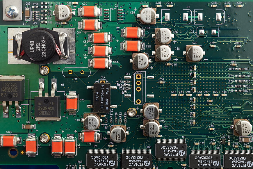 Close-up of green computer motherboard circuit board components