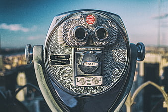 Close-up of a vintage coin-operated binocular viewer in New York City