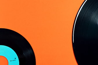 Vinyl Records on Vibrant Orange Background