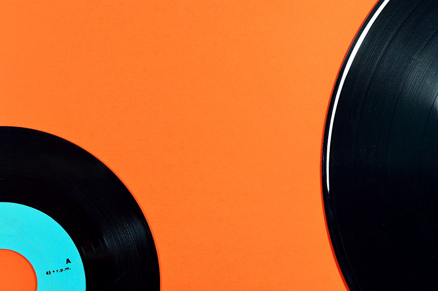 Vinyl Records on Vibrant Orange Background