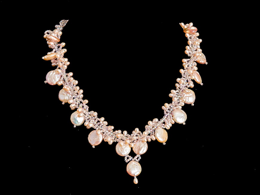Luxurious Gold Pearl and Diamond Necklace on Black Background