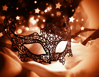 Black Lace Masquerade Mask on White Fabric with Starry Background