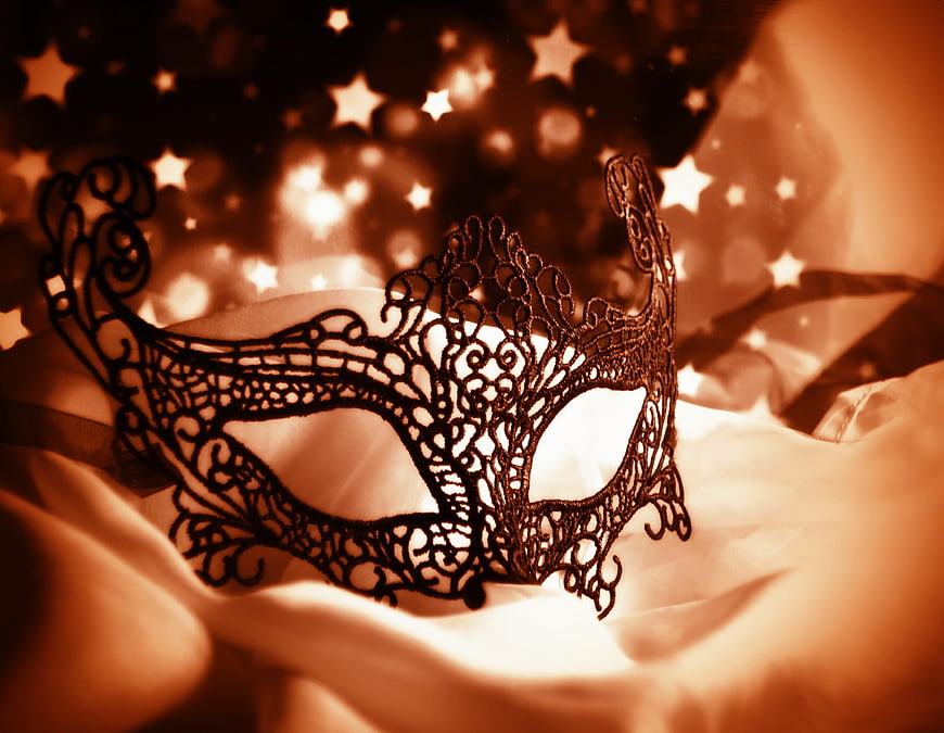 Black Lace Masquerade Mask on White Fabric with Starry Background