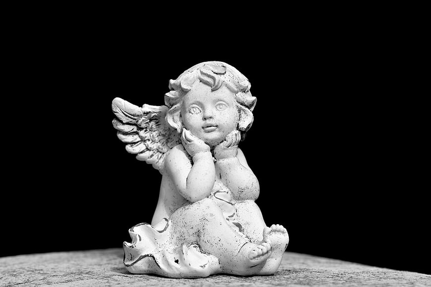 Monochrome Angel Statue Sculpture on Textured Surface