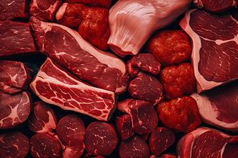 Assortment of raw red meat cuts and steaks top view