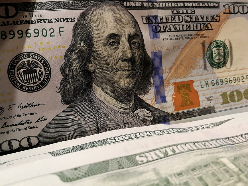 Close-up of US one hundred dollar bills with Benjamin Franklin portrait